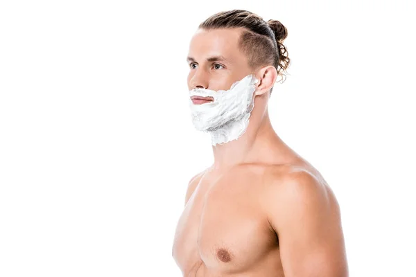 Sexy shirtless man with foam on face isolated on white — Stock Photo