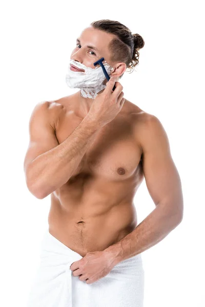 Sexy shirtless man with foam on face shaving isolated on white — Stock Photo