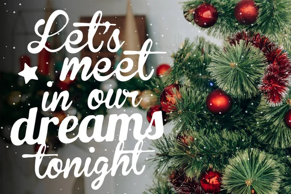 Pine branches near decorated fireplace and lets meet in our dreams tonight lettering — Stock Photo