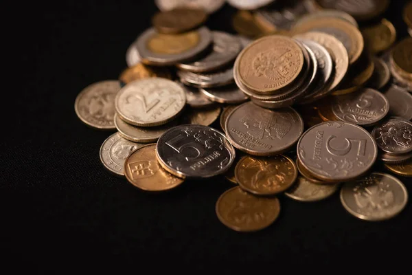 Coins on black background, funeral concept — Stock Photo