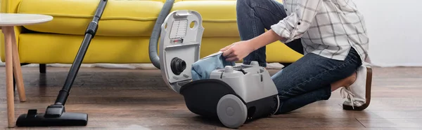 Partial view of housewife changing dust bag in vacuum cleaner, banner — Stock Photo