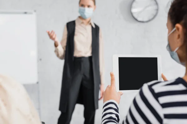 African american woman holding digital tablet with blank screen near speaker — Stock Photo