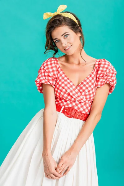 Happy pin up woman looking at camera while posing isolated on turquoise — Stock Photo