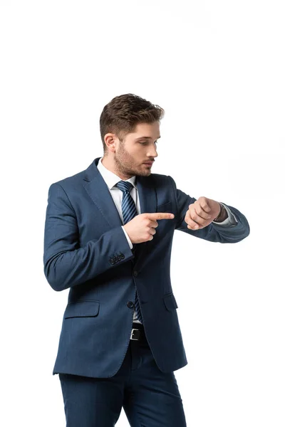 Businessman pointing with finger at wristwatch isolated on white — Stock Photo