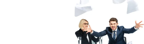 Angry broadcaster throwing papers near colleague isolated on white, banner — Stock Photo