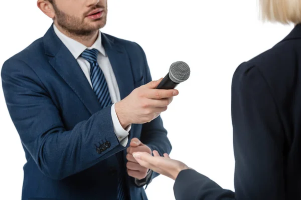 Cropped view of newscaster with microphone taking interview from businesswoman isolated on white — Stock Photo