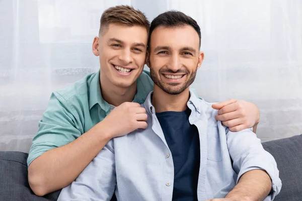 Happy same sex family smiling and looking at camera — Stock Photo