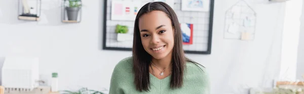 Smiling african american architect looking at camera at home studio, banner — Stock Photo