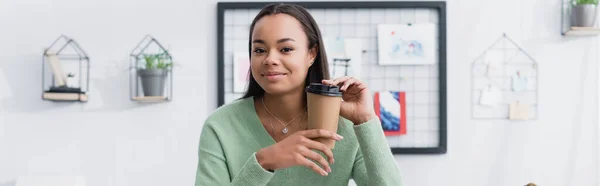 African american architect smiling at camera while holding coffee to go, banner — Stock Photo