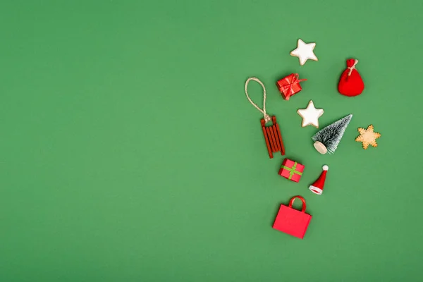 Different christmas baubles and cookies on green background with copy space — Stock Image Different Christmas Baubles Cookies Green Background Copy Space Royalty Free Stock Photos