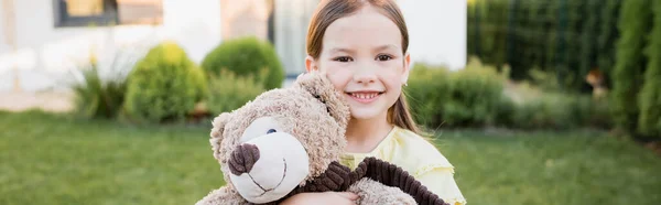 Portrait Smiling Girl Teddy Bear Looking Camera Blurred Background Banner — Stock Photo, Image