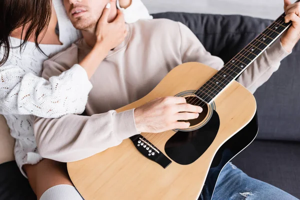 Cropped View Woman Touching Neck Boyfriend Acoustic Guitar Couch — Stock Photo, Image