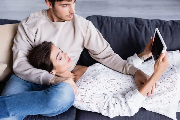Young Couple Using Digital Tablet Blank Screen Couch — Stock Photo, Image