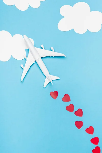 Top View Plane Model Red Hearts Blue Background White Clouds — Stock Photo, Image