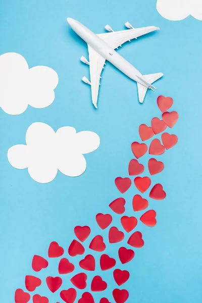 Top View Plane Model Red Hearts Blue Background White Clouds — Stock Photo, Image