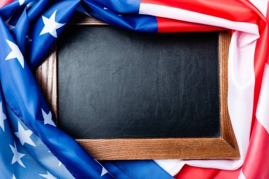 top view of blank chalkboard near flag of american with stars and stipes  clipart