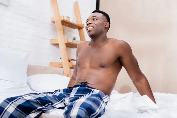 Positive African American Man Checkered Pants Sitting Bed — Stock Photo, Image