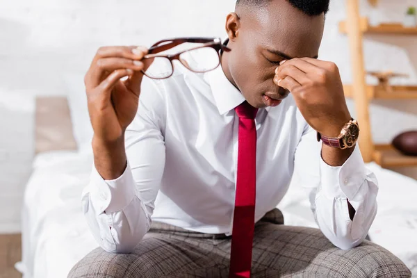 Tired African American Businessman Holding Eyeglasses Blurred Foreground Home — Stock Photo, Image