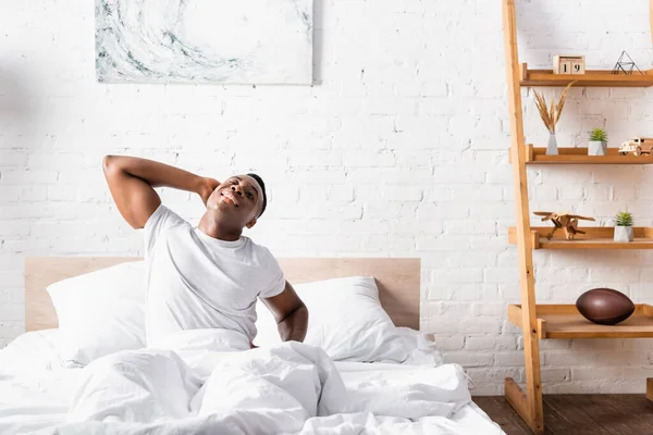 Cheerful African American Man Stretching Bed Morning — Stock Photo, Image