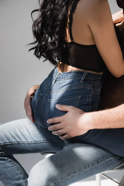 Cropped View Man Touching Butt Sensual Woman Jeans Chair Grey — Φωτογραφία Αρχείου