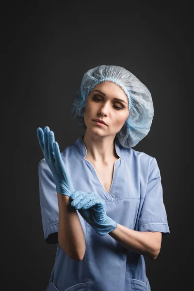 Nurse Medical Cap Wearing Latex Gloves Isolated Dark Grey — Stock Photo, Image