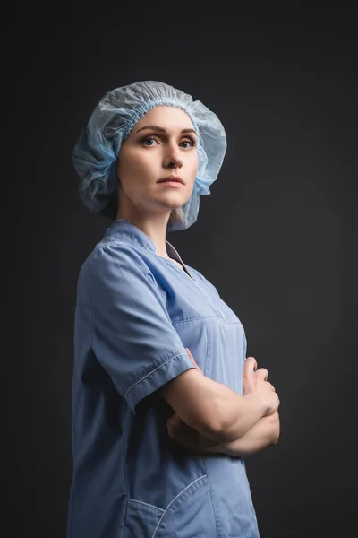 Nurse Blue Medical Cap Standing Crossed Arms Isolated Dark Grey — Stock Photo, Image