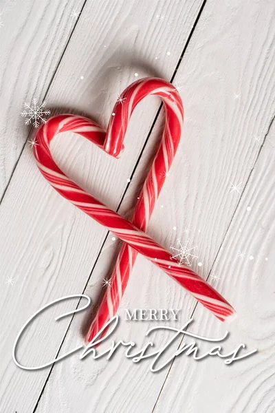 Top Pohled Sladké Candy Canes Tvaru Srdce Blízkosti Veselých Vánočních — Stock fotografie