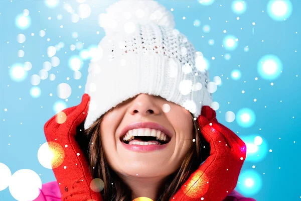 Joyful Woman Red Gloves Covering Eyes While Adjusting White Hat — Stock Photo, Image