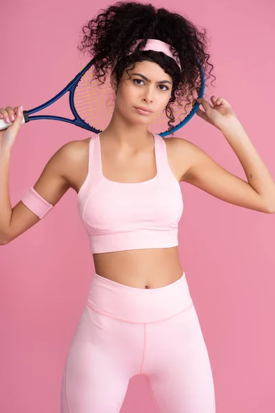 Curly Young Sportswoman Holding Tennis Racket Looking Camera Isolated Pink — Stock Photo, Image