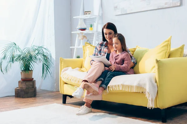 Full Length Happy Mother Daughter Looking Copy Book While Sitting — Stock Photo, Image