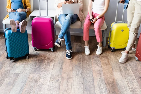 Cropped View Pregnant Woman Sitting People Devices Suitcases Airport — Stock Photo, Image