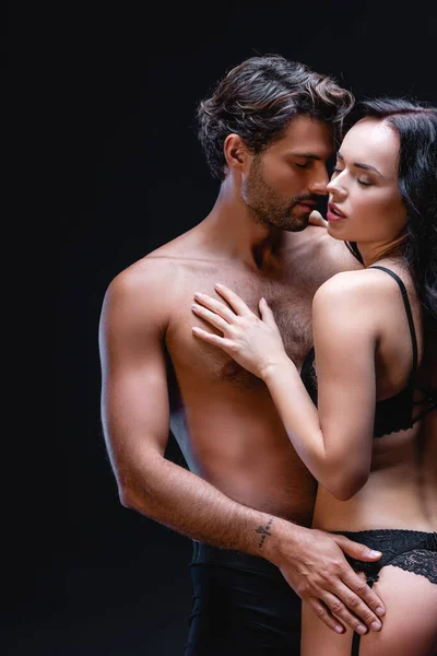 Young Shirtless Man Embracing Sexy Woman Lace Lingerie Isolated Black — Stock Photo, Image