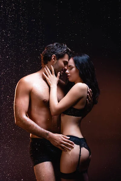 Sexy Shirtless Man Embracing Seductive Woman Black Lingerie Stockings Dark — Stock Photo, Image