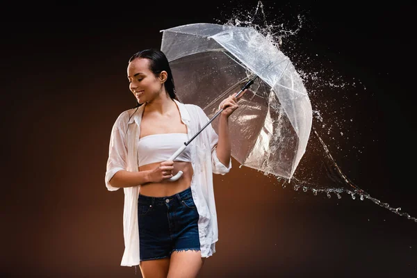 Happy Woman White Shirt Denim Shorts Holding Umbrella Water Splashes — Stock Photo, Image