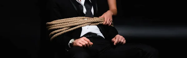 Cropped View Dominant Woman Holding Rope Tied Submissive Man Sitting — Stock Photo, Image