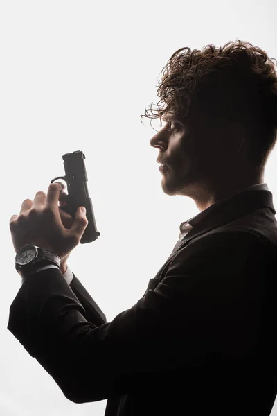 Side View Curly Man Suit Holding Gun Isolated White — Stock Photo, Image