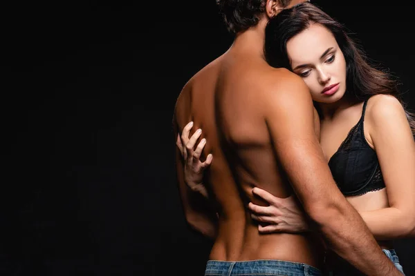 Young Sensual Woman Embracing Shirtless Muscular Man Isolated Black — Stock Photo, Image