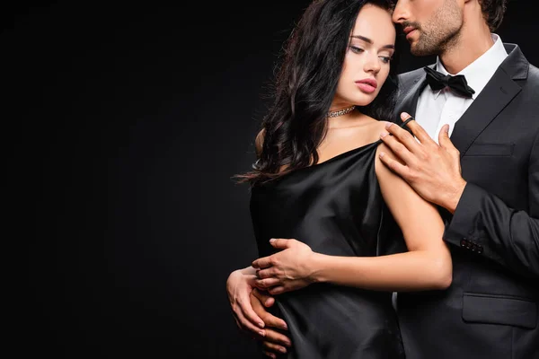 Young Man Seducing Sensual Brunette Woman Satin Dress Isolated Black — Stock Photo, Image