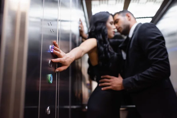 Woman Pushing Button Elevator While Kissing Boyfriend Blurred Background — Stock Photo, Image