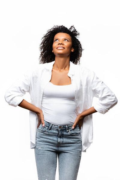 Positive african american woman looking up isolated on white 