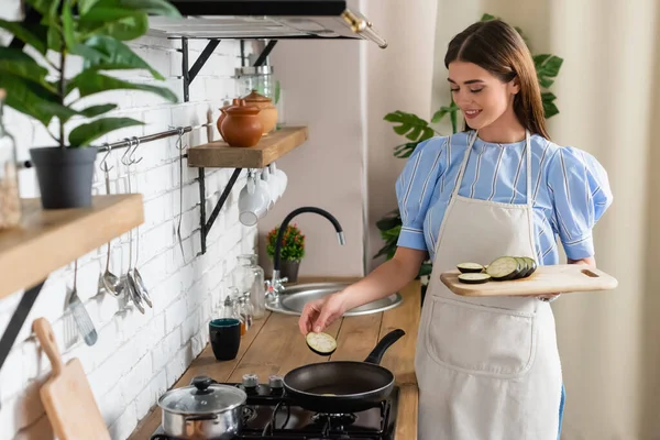 Young Adult Woman Putting Slices Eggplant Frying Pan Kitchen — Stock Photo, Image