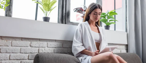 Young Adult Woman Bathrobe Sitting Couch Looking Tablet Modern Living — Stock Photo, Image