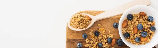 Top view of delicious granola with nuts, blueberry and dried apricots isolated on white, banner — Stock Photo