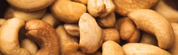 Closeup of delicious cashew nuts background, banner — Stock Photo