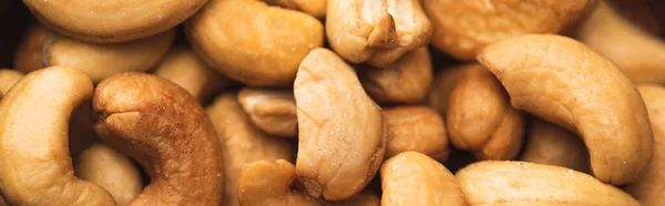 Closeup of delicious cashew nuts background, banner — Stock Photo