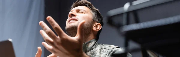 Military man in uniform gesturing while expressing feelings, banner — Stock Photo