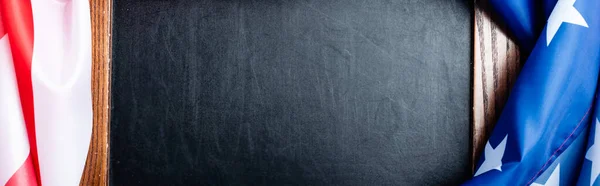 Top view of blank chalkboard near flag of american with stars and stipes, banner — Stock Photo