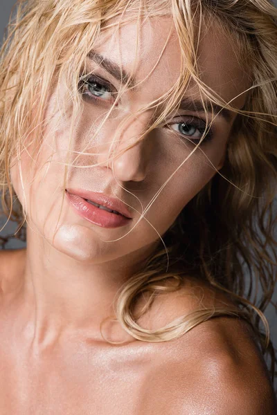 Blonde woman with wet hair isolated on grey — Stock Photo