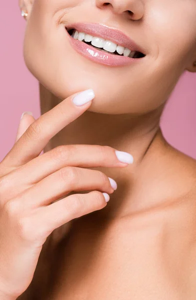 Cropped view of beautiful woman with perfect skin touching face isolated on pink — Stock Photo