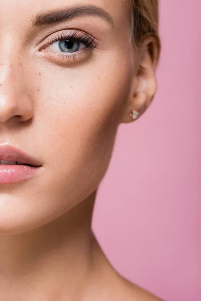 Cropped view of beautiful woman with freckles isolated on pink — Stock Photo